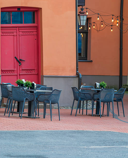istock chairs and small tables in a street outdoors cafe 2206969616