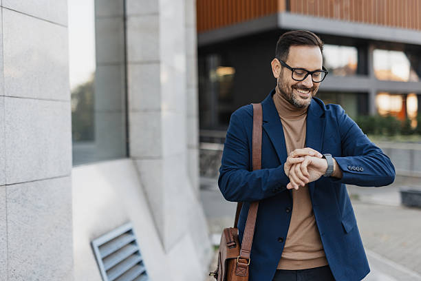 istock Businessman Checking Time With Smartwatch in City 2206971804