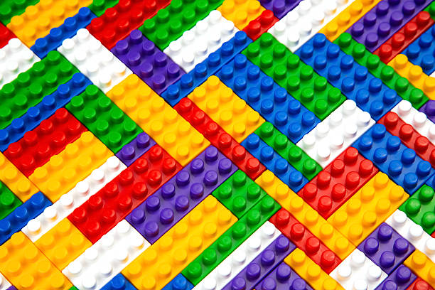 istock Abstract background texture of colored constructor blocks. Background of colorful plastic part of constructor. Pile of colored toy bricks. 2206972695