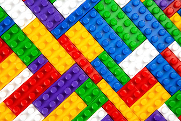 istock Abstract background texture of colored constructor blocks. Background of colorful plastic part of constructor. Pile of colored toy bricks. 2206974177