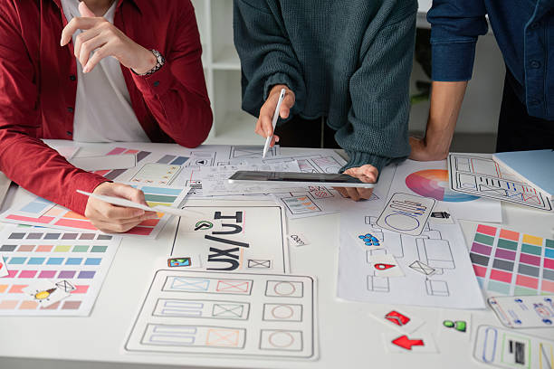 istock Creative Meeting and UI/UX Strategy. Design professionals refining concepts and presentations together. 2206974529