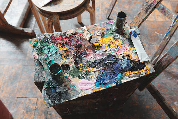 istock An EyeCatching and Colorful Artists Palette Fully Loaded with Various Paints and Brushes 2206975442