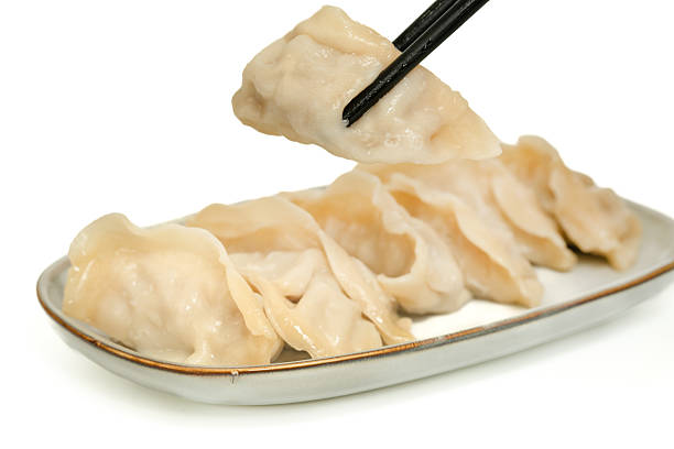istock Chinese Gyoza dumplings Isolated on white 2206975898