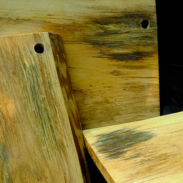 istock wooden cutting board isolated on a black background 2206977456
