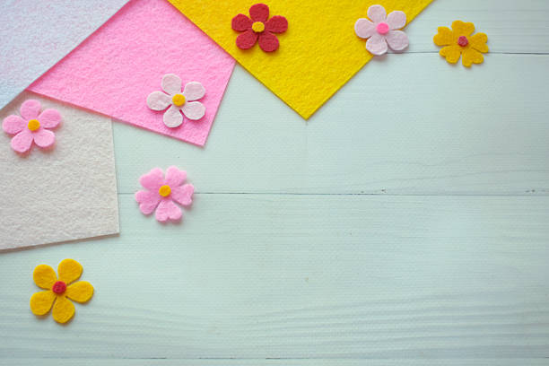 istock Flat lay felt flowers and fabric sheets, pastel background, DIY craft composition, handmade textile art, creative sewing, soft floral decoration, colorful petals, home decor idea 2206979019