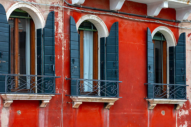 Typical facade of house with windows in Venice