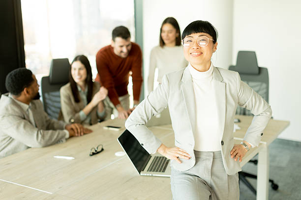 istock Business professionals collaborate in a modern office setting during a productive meeting session 2206980524