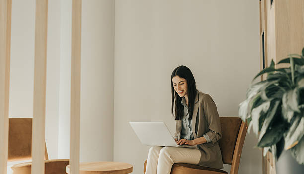 istock Working in solitude a woman finds joy in her digital creations at a cozy workspace 2206982460