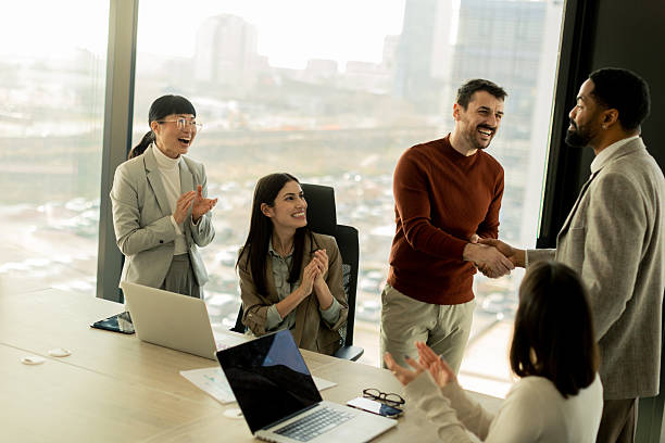 istock Exciting moments of success in a modern office setting filled with celebration and teamwork 2206982496