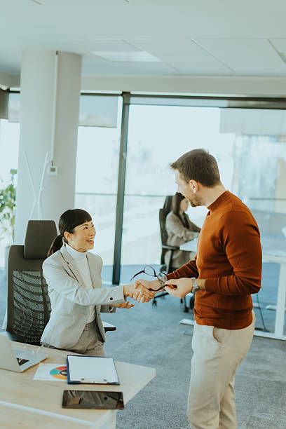 istock Successful business meeting between two professionals in a modern office setting 2206982516