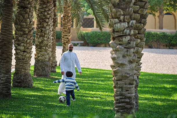 istock Father playing a fun soccer game in the park with his son 2206983796