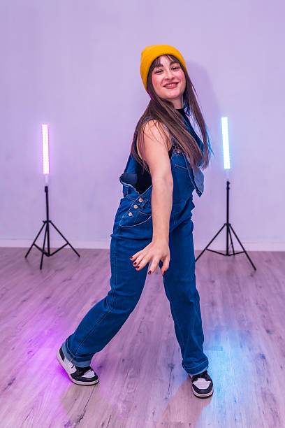 istock Young dancer performing with stylish moves in a modern studio 2206983974