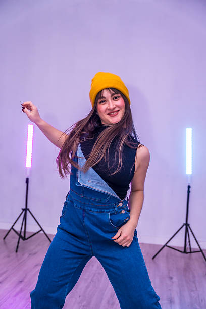 istock Young dancer performing with led lights in a dance academy 2206984478