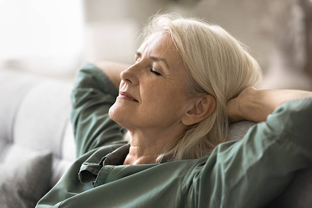 istock Close up serene elderly woman relaxing comfortable in cozy environment 2206985780