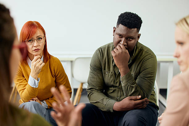 Group Discussion in Circle Showing Serious and Engaged Participants in Close Interaction