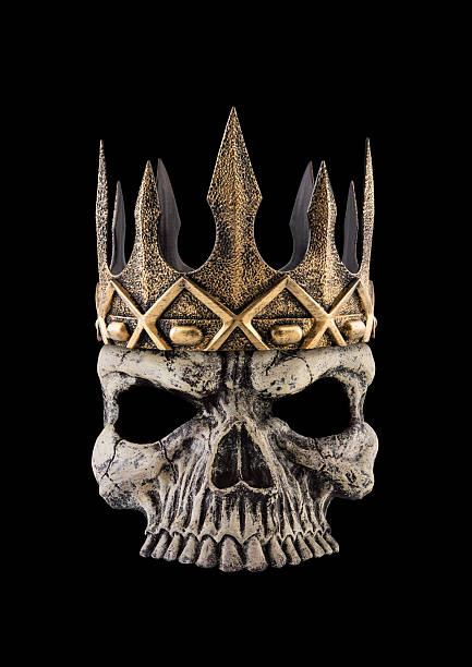 Human skull with ancient golden crown isolated on black background