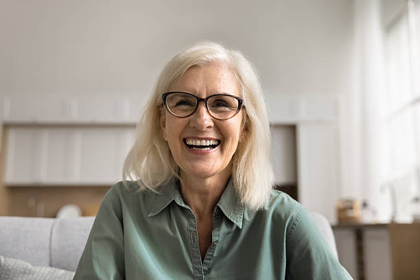 istock Older woman engaged in joyful conversation through video call 2206987094