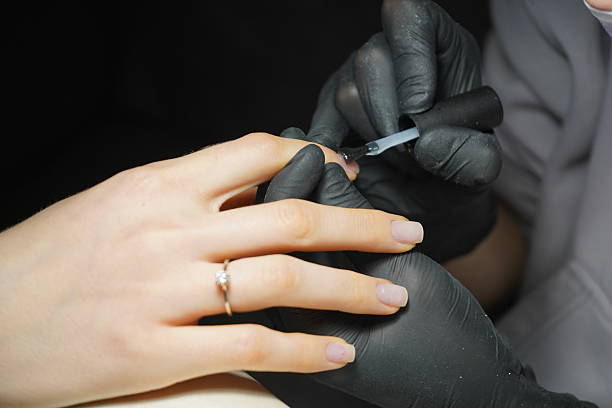 istock Close-Up of Hands Getting a Manicure 2206987182