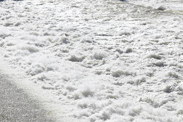 istock Small waterfall with moving water during a river flood 2206988972
