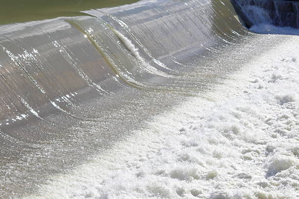 istock Small waterfall with moving water during a river flood 2206988977