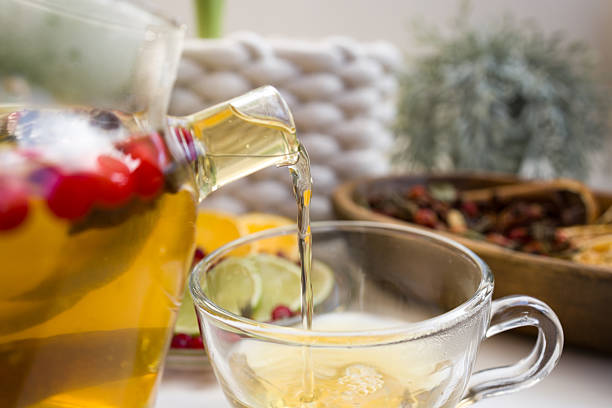 Cranberry, lemon and lime tea with cinnamon sticks. An alternative medicine for colds and flu
