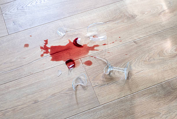 istock Glass from a broken glass on the floor, a stain from red wine. 2206990391