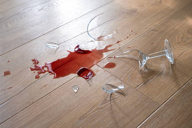 istock Glass from a broken glass on the floor, a stain from red wine. 2206990429