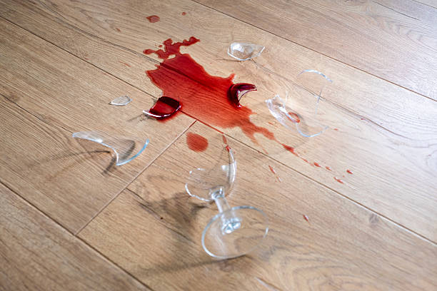 istock Glass from a broken glass on the floor, a stain from red wine. 2206990455