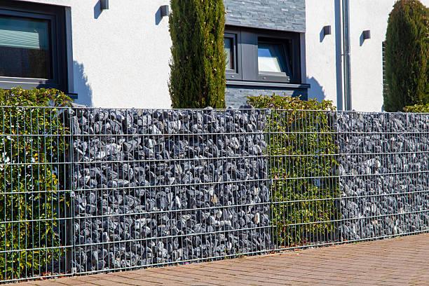 istock Gabion as a modern and high-quality visual protection and property boundary 2206990538
