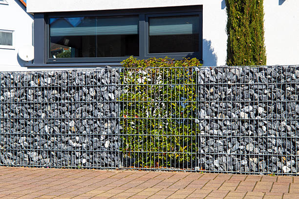 istock Gabion as a modern and high-quality visual protection and property boundary 2206990555