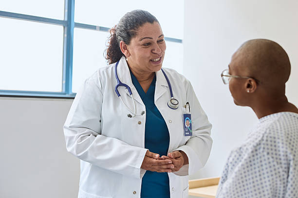istock Doctor communicating with woman suffering from cancer 2206991421