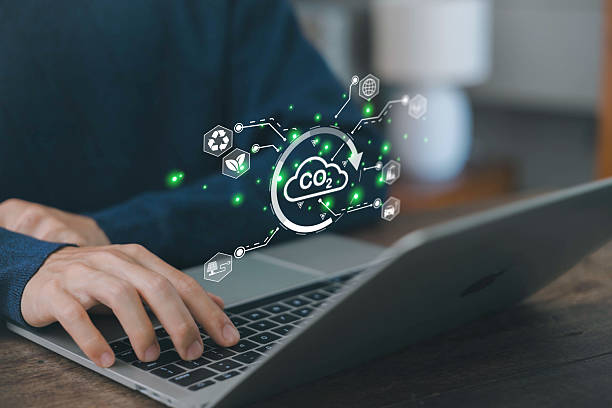 istock CO2 or carbon concept, Reduce CO2 emissions and turn to environmental technology and renewable energy, Businessman shows icon in front of him. planting tree, solar cells, renewable energy 2206991936