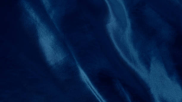 istock Dreamy silk texture in soft blue shades with flowing waves and delicate glow 2206994379