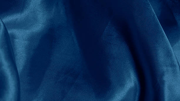 istock Dreamy silk texture in soft blue shades with flowing waves and delicate glow 2206994560