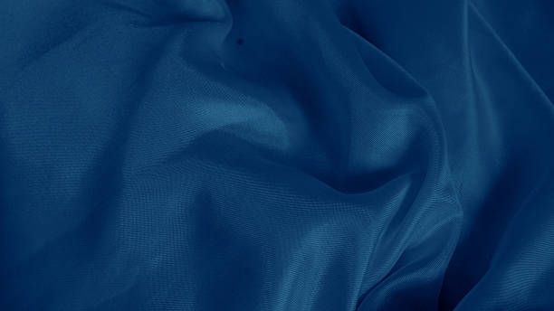 istock Dreamy silk texture in soft blue shades with flowing waves and delicate glow 2206994653