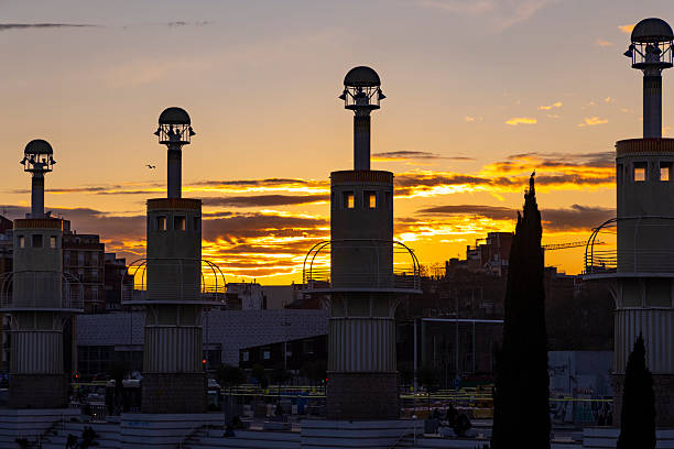 Evening view of Parc de l’Espanya Industrial in Barcelona, showcasing its unique architectural features and serene atmosphere under twilight skies.