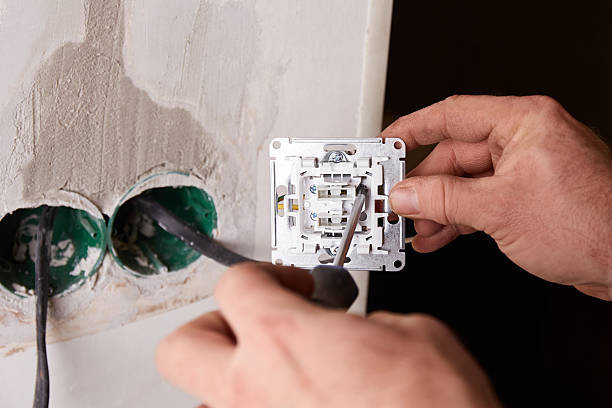 istock A close-up view of an electrical outlet being installed into a wall. 2206996369