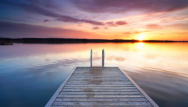 istock magic calm evening at the wooden pier, summer 2206996700