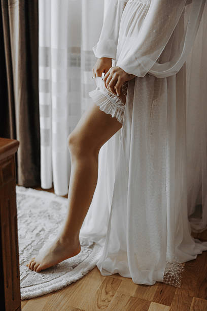 istock A woman in a white dress is getting ready for a wedding 2206997453