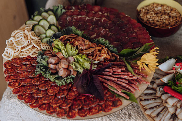 istock A large platter of assorted meats and vegetables is displayed on a table 2206997533