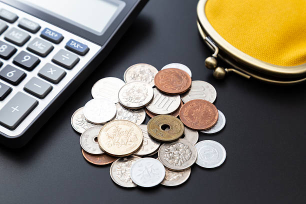 istock A calculator, a wallet and some coins. 2207000002