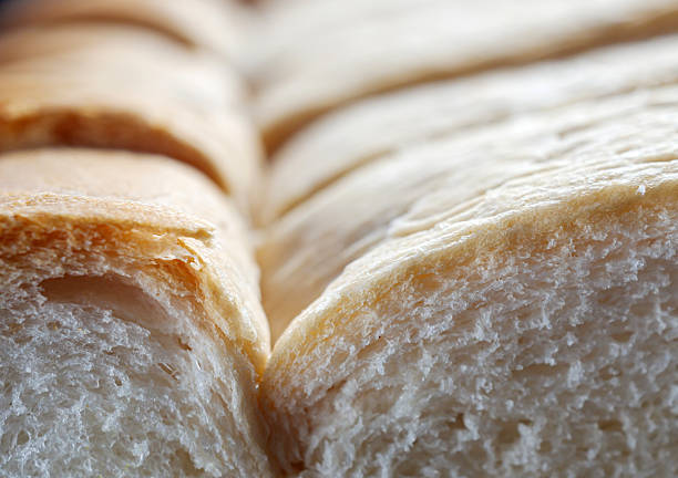 Fresh, soft and fragrant bread with brown edges macro food