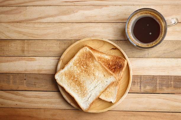 istock Breakfast of toast bread and black coffee 2207002805