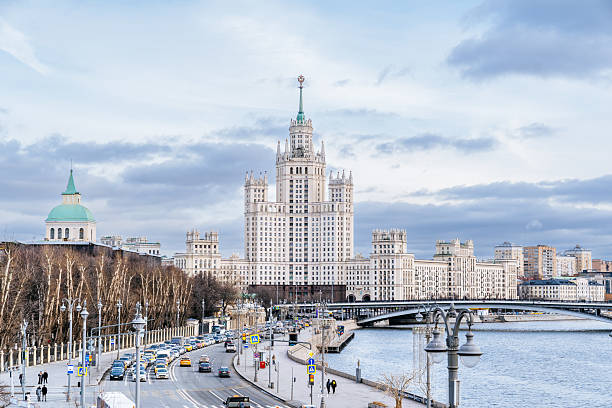 Kotelnicheskaya Embankment Building and Moscow River with Road and Pedestrian Walkways, Russia. stock photo