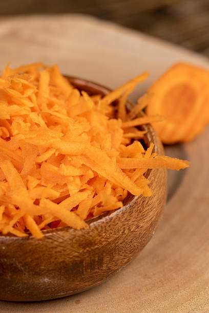 istock grated orange carrots on the table during cooking 2207005558