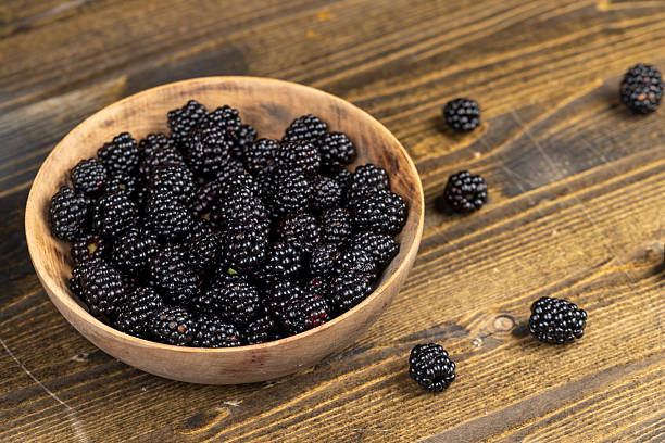 istock sour but ripe blackberries on the table 2207005805
