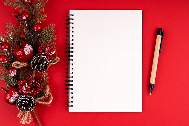 istock Christmas decorations and empty notebook for copy space on red background. Christmas concept. 2207008234