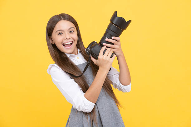 pure happiness. hobby or career. photographer beginner with modern camera. making video. childhood. teen girl taking photo. kid use digital camera. happy child photographing. school of photography.