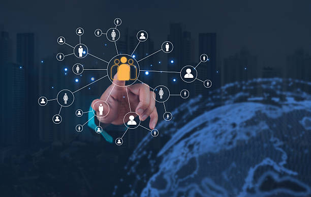 istock Digital security concept with a hand pointing at a network of connected user icons and a globe in the background. 2207010502