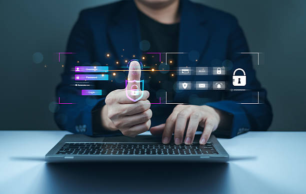 istock A person in a suit is using a laptop, displaying a digital interface with security icons and data visualization elements. 2207010656